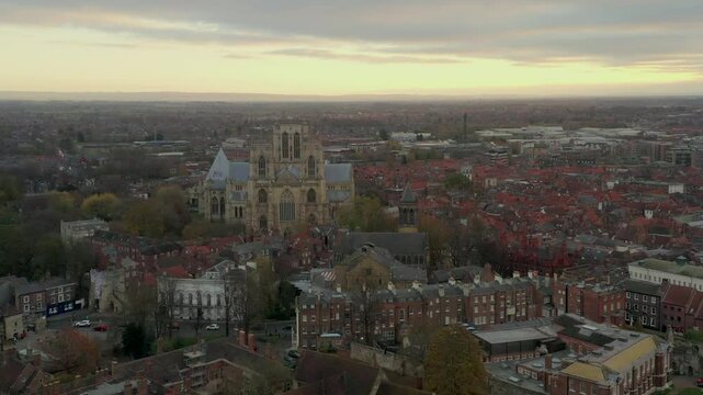 Drone shot of York Minster and surrounding historical buildings during sunset in York, UK