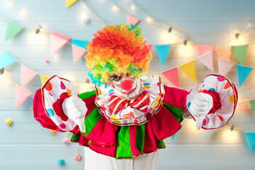Angry, bad clown thumbs down, man entertainer as Joker in a suit and wig, with clown whiteface...