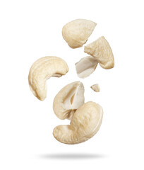 Whole and cracked dried cashew close-up on a white background