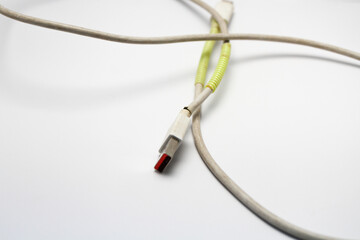 Obraz premium USB cable type C tangled over white isolated background