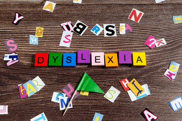 Word dyslexia in colourful letters and flag
