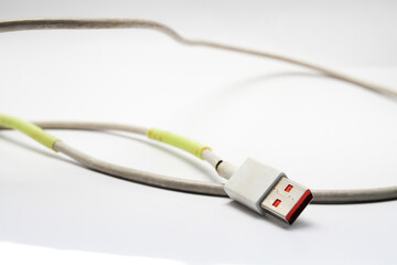 USB cable type C tangled over white isolated background