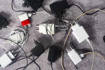 Several chargers for various gadgets.