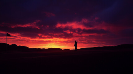 A dramatic sunset scene on a golf course, with a lone golfer silhouetted against the sky, taking a shot towards the flag on a distant green.