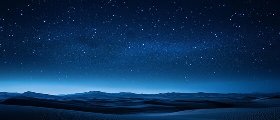 A starry night sky with a blue background