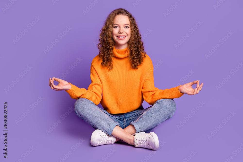 Sticker Full length portrait of lovely young girl sit floor meditate wear sweater isolated on purple color background