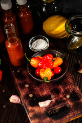 Superhot Habanero Peppers: Fresh and Spicy Chili with Ingredients on a Wooden Background