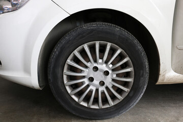 white car tire with cover rim