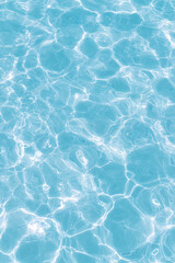 Refreshing background of blue water with sunlight rays concept for skin hydration and cleansing, spa ambiance, and pool relaxation experience for rejuvenating therapy and wellbeing
