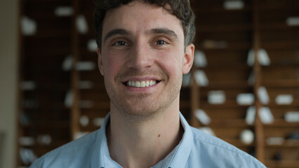 Obraz premium Happy confident young adult Caucasian male portrait client guy businessman student model friendly smiling looking camera wide healthy toothy smile man posing business office psychotherapy cabinet room