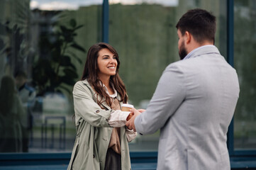 Business people talking and having coffee outside the office