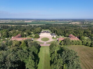 Countryside in Burgundy, France, with an old manor house, fields and forests