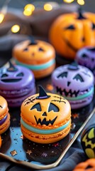 Obraz premium Colorful Halloween-themed macarons shaped like pumpkins and decorated with ghostly faces for a festive celebration
