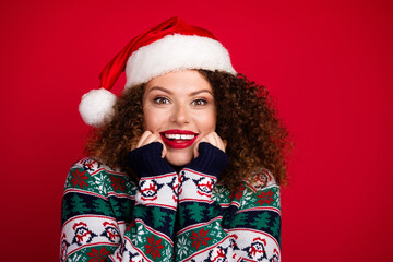 Photo of pretty young woman beaming smile empty space wear christmas festive sweater isolated on red color background