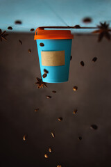 conceptual creative photography of coffee in a takeaway blue mockup cup, with copy space. inverted...
