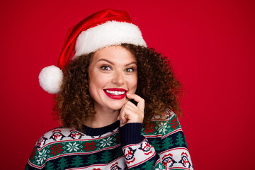 Portrait of nice young girl think empty space wear new year xmas sweater isolated on red color background
