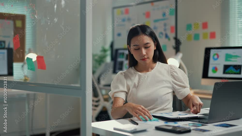 Aufkleber young professional concentrating on tablet analysis while organizing colorful sticky notes in a mode
