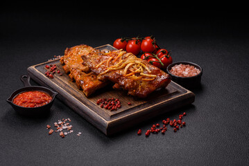 Pork or beef ribs with salt, spices and herbs baked on the grill