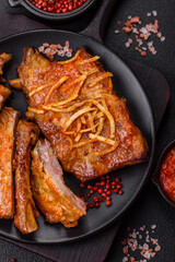 Pork or beef ribs with salt, spices and herbs baked on the grill