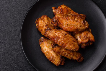 Grilled chicken wings with salt, spices and herbs