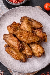 Grilled chicken wings with salt, spices and herbs