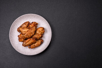 Grilled chicken wings with salt, spices and herbs