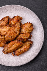 Grilled chicken wings with salt, spices and herbs
