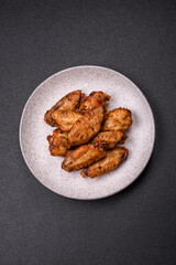 Grilled chicken wings with salt, spices and herbs