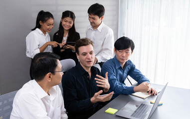 Group of diverse office worker employee working together on strategic business marketing planning in corporate office room. Positive teamwork in business workplace concept. Prudent