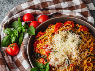 Delicious Fettuccine Pasta with Fresh Tomato Pomodoro Sauce and Parmesan Garnished with Basil