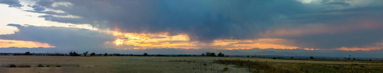 Stormy fall sunset over the prairies and mountains in Aurora, Colorado