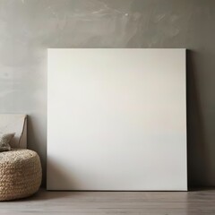 Minimalist interior canvas mockup with a blank canvas against a neutral wall. Perfect for displaying artwork or posters in a modern, clean space