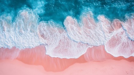 Crashing turquoise waves on a pink beach create foam patterns in a serene tropical paradise, perfect for a summer vacation