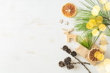 Eco christmas background with gift box and pine branches, wooden decor. Zero waste holidays