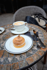 Cafe coffee cappuccino cake autumn cozy outdoor. Lemon tart cake on cafe table.