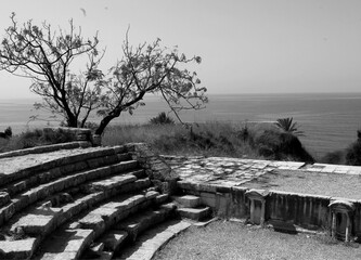 Ancient Roman theatre ruins in Byblos overlooking the Mediterranean Sea. The tranquil scene...