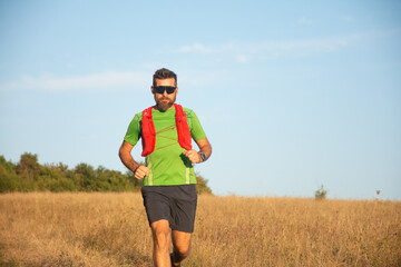 A man Runner of Trail and athlete's feet wearing sports shoes for trail running