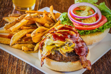 cheeseburger topped with BBQ sauce, jalepenos, and queso cheese