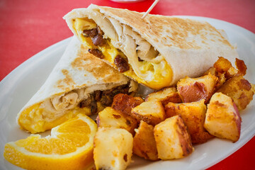 breakfast wrap with scrambled eggs, sausage, and cheese