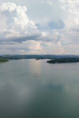 Serene lake view with soft waves reflecting a cloudy sky, ideal for calming landscapes and nature themes.