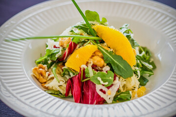citrus salad on a bed of mixed greens