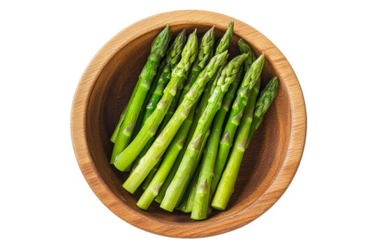 Fresh Asparagus in wooden bowl from top view isolated on background, flat lay view of freshness salad vegetables for health.