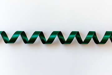 Green ribbon on white background, top view. Text space available.