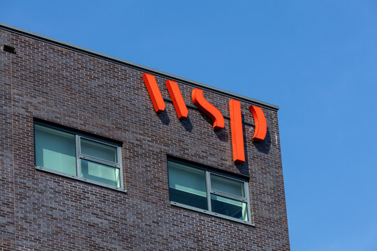WSP logo sign on the building. WSP is a globally services firm providing strategic advisory, engineering and design services. Utrecht in the Netherlands, 14 April 2023. 
