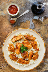 crispy sautéed chicken in an orange marmalade sauce