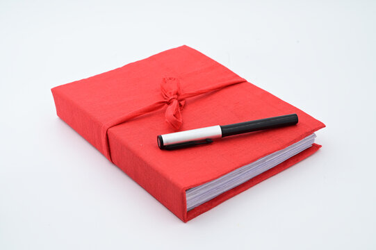 BENGALI NEW YEAR OR NABABARSHA HALKHATA WITH PEN ON ISOLATED WHITE BACKGROUND.