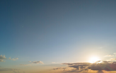 A beautiful sunset sky with soft clouds and warm light illuminating the horizon, creating a serene atmosphere perfect for relaxation and inspiration.