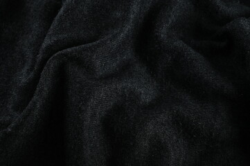 BLACK CLOTH TOP VIEW WITH SELECTIVE FOCUS.