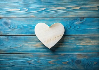 Top View of Blank Paper with Heart on Blue Wooden Background for Love and Romance Themes