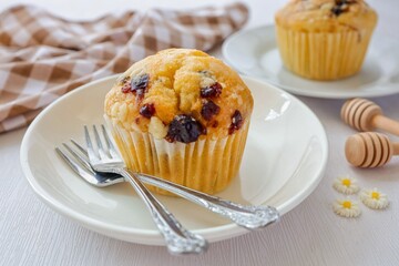 Muffin in white plate on white background,